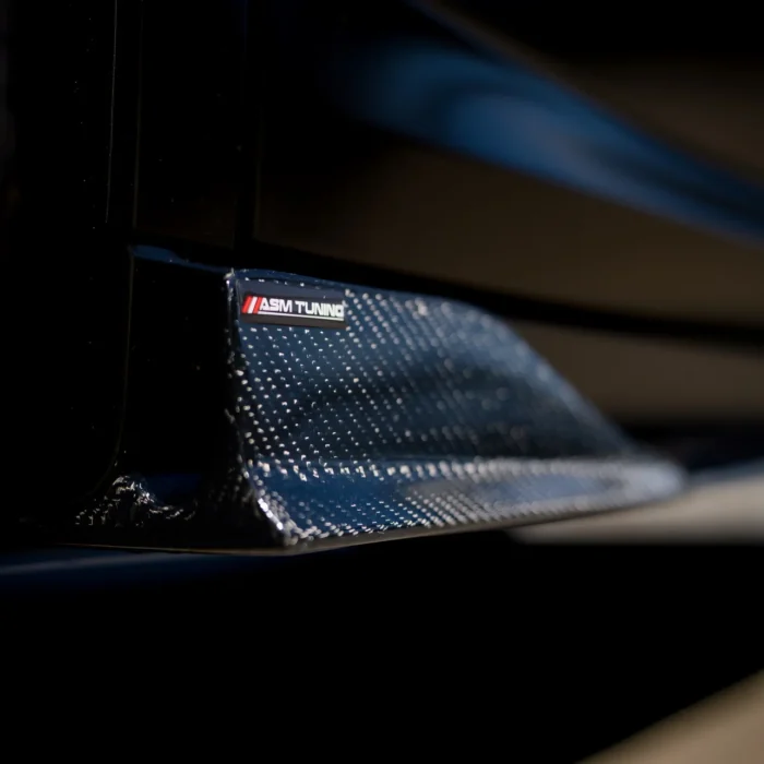 Detail of gloss carbon fibre rear diffuser on BMW X4M LCI with ASM Tuning logo, showing lightweight performance part