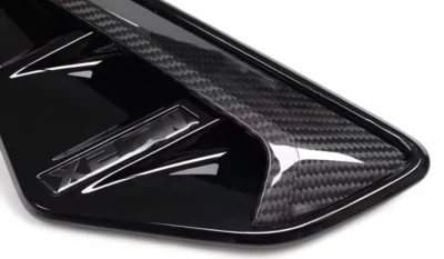 Close-Up Detail Of Bmw X5M F95 M-Performance Carbon Fibre Vent – High-Gloss Finish And Weave Texture Quality