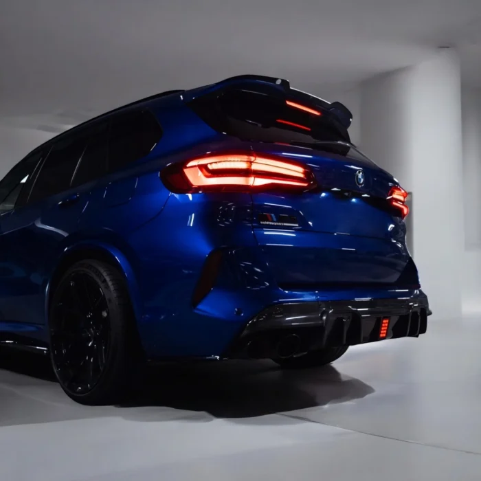 BMW X5M F95 with ASM carbon fibre diffuser – rear right side view in dark setting