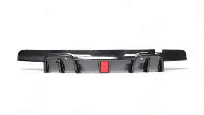 BMW X5M F95 carbon fibre rear diffuser – full straight-on product shot showing central brake light and aggressive fins