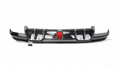 Top-down angled view of BMW X5M F95 carbon fibre diffuser – highlights carbon weave and aerodynamic venting