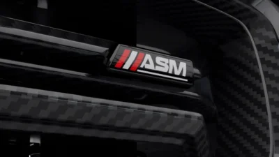 Macro Shot Of The Asm Logo On Carbon Grille In Close Detail