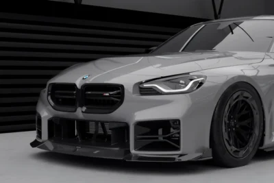 BMW G87 M2 Carbon Front Lip – angled close-up showing full aero setup and grille integration