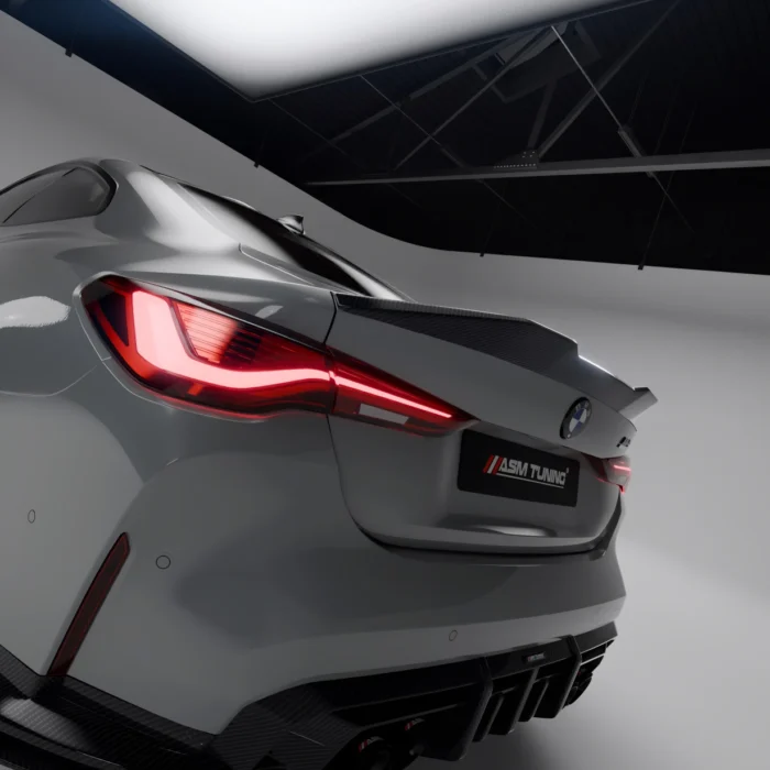 Close-up of left rear tail light and carbon spoiler edge on grey BMW G82 with ASM Tuning styling