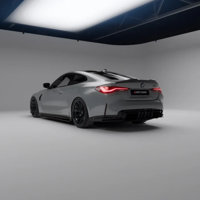 Angled rear shot of grey BMW M4 G82 highlighting carbon rear diffuser profile
