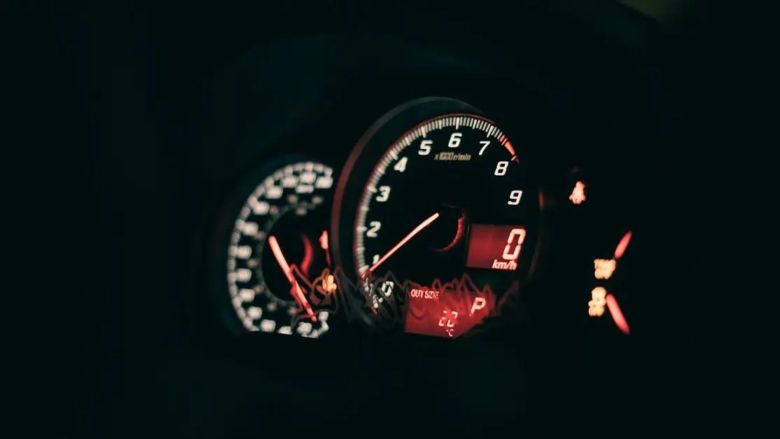 Car dashboard with illuminated speedometer highlighting benefits of ECU remapping for performance