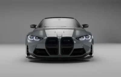 Front view of BMW G82 M4 with a dry carbon fiber splitter installed, showcasing aggressive aero design and performance styling