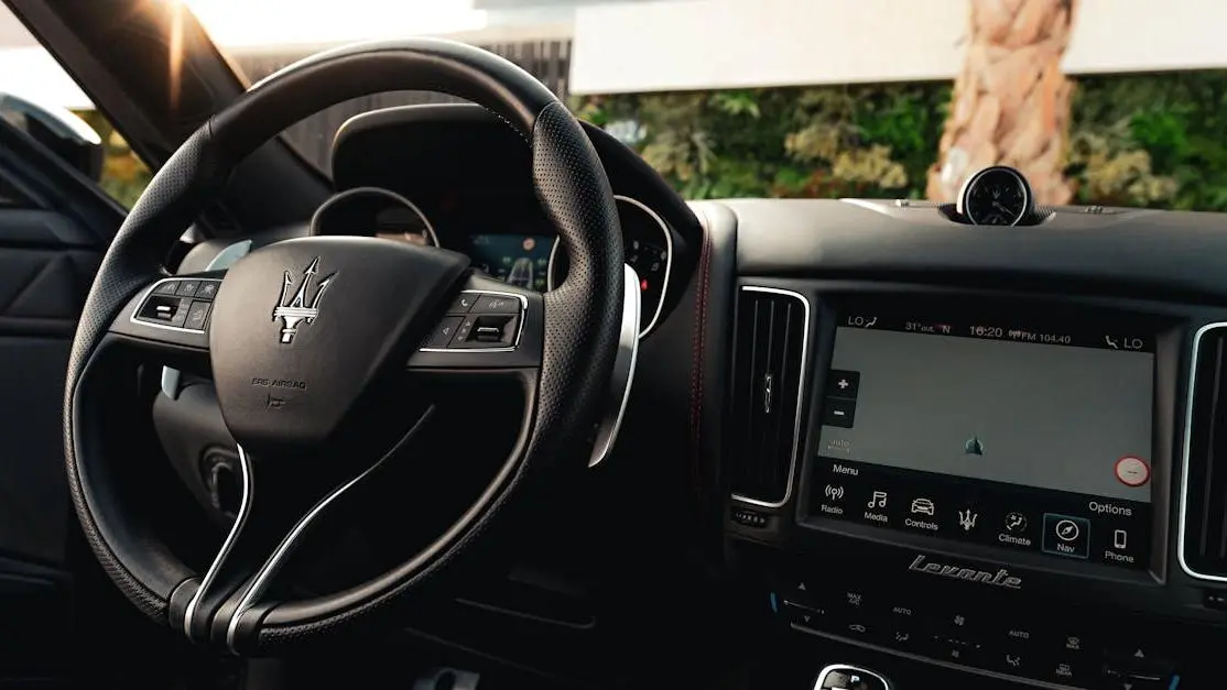 Maserati interior with quick release steering wheel installation.