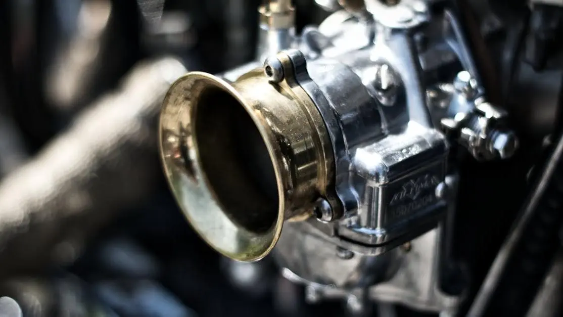 Motorcycle engine close-up highlighting fuel injectors being upgraded for performance improvement.